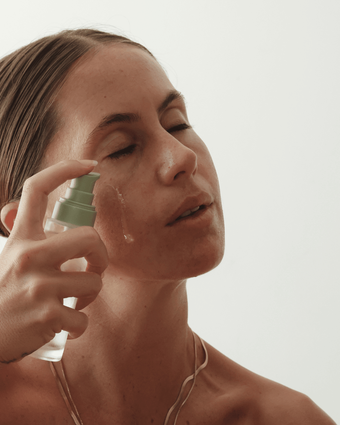 A woman applying best serum for dry skin Biobod&