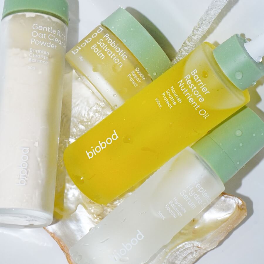 Biobod skincare products including a powder, balm, and oil on a white background
