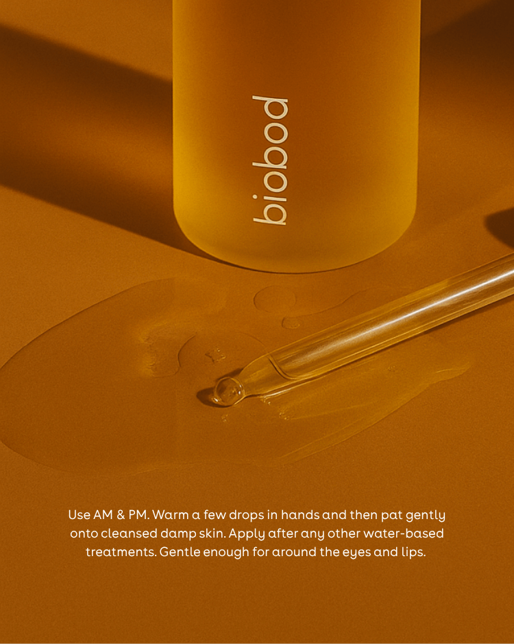 face oil for sensitive skin bottle and dropper on a warm brown background with product usage instructions.