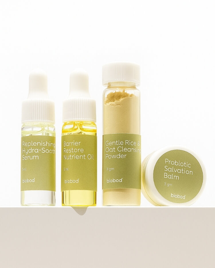 Set of skincare sample sets products including serum, oil, powder, and balm on a white background