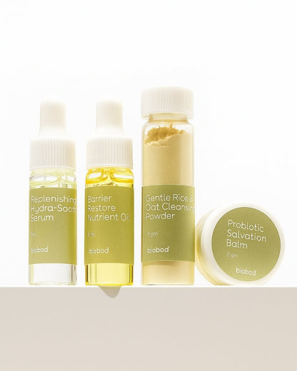 Set of skincare sample sets products including serum, oil, powder, and balm on a white background