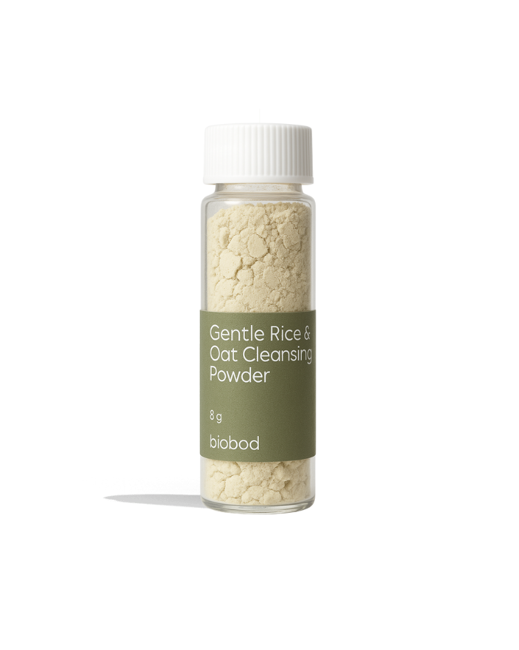 A clear bottle with a white label containing the text &