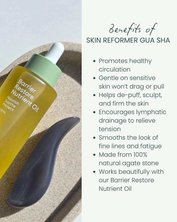 Barrier Restore Nutrient Oil bottle with Gua Sha for sensitive skin tool on a textured surface, featuring product benefits text.