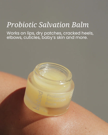 Jar of Probiotic Salvation Balm on skin with product description text.